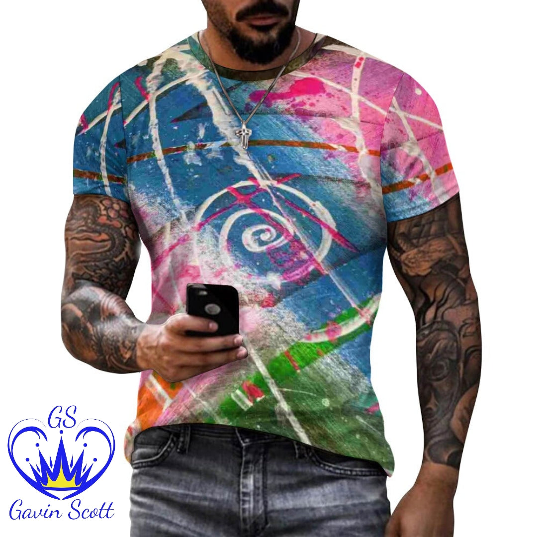Man wearing colorful abstract graffiti print t-shirt with tattoos holding a phone